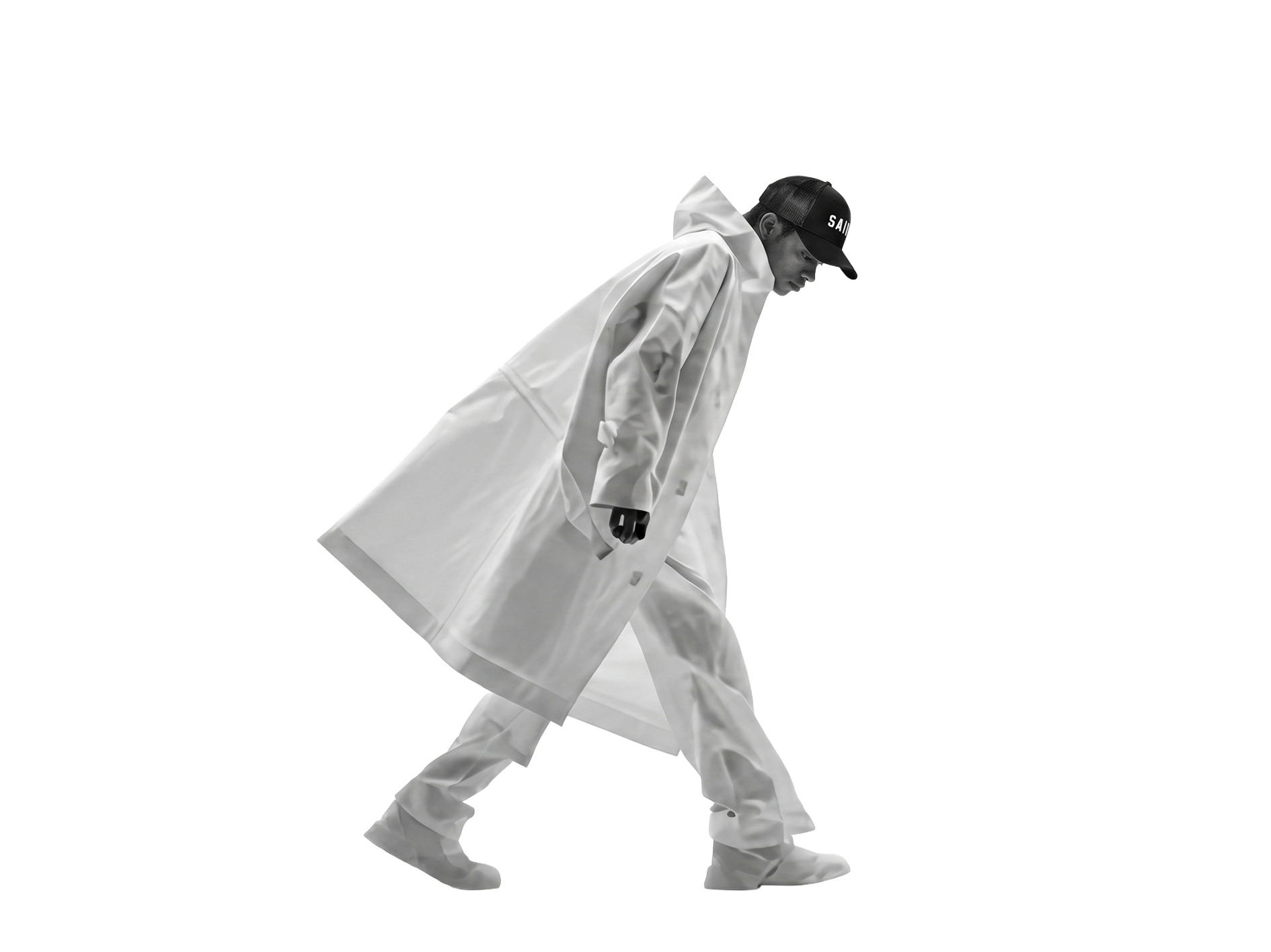 A man in a Saint cap and long translucent coat, walking